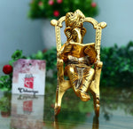 Metal Lord Ganesh Reading Ramayana Statue Ganpati Sitting on Chair with Kuber Diya in Berlin