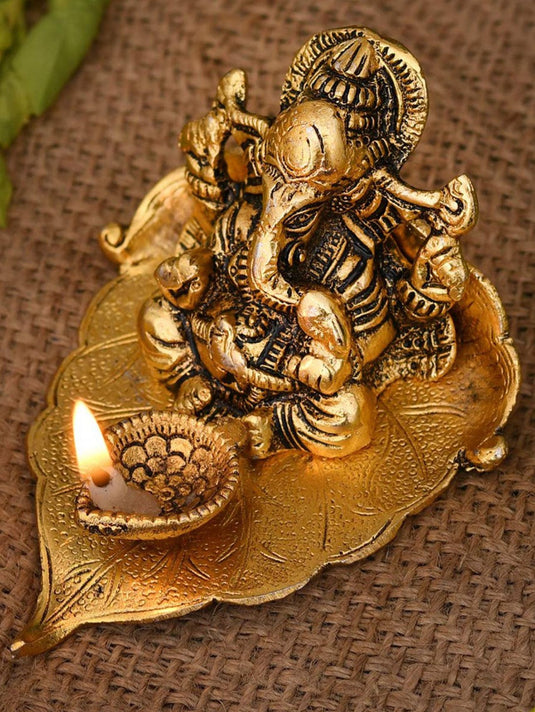 Gold-Toned & Black Ganesha On Leaf With Diya Showpiece in Berlin