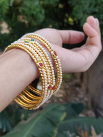 Mad Club elegant pearls studded gold plated 4 pcs bangles set in Munich