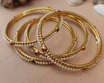 Mad Club elegant pearls studded gold plated 4 pcs bangles set in Munich