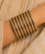 Traditional Brown and Gold Bangle Stack in Berlin