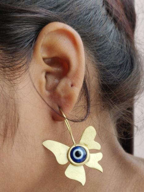 Evil eye stone with butterfly shaped brass earrings in Germany Namma Markt