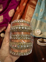 Peach Kundan bangles set in Germany