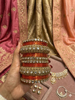 Orange Kundan bangles set in Germany