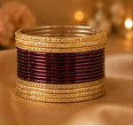 Maroon and gold traditional bangle set in Germany