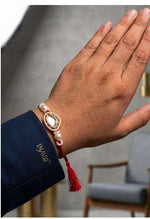 Traditional Kundan and Pearl Brother Rakhi on Wrist in Germany Namma Markt
