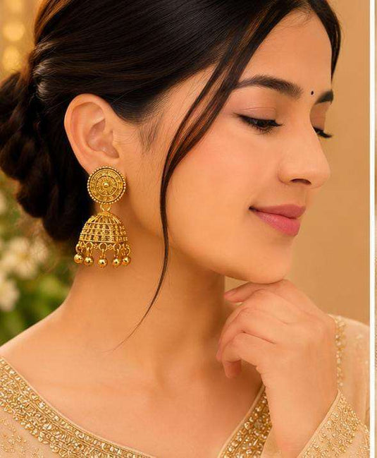 Woman in Traditional Indian Attire and Gold Jhumka Earrings in Berlin Namma Markt