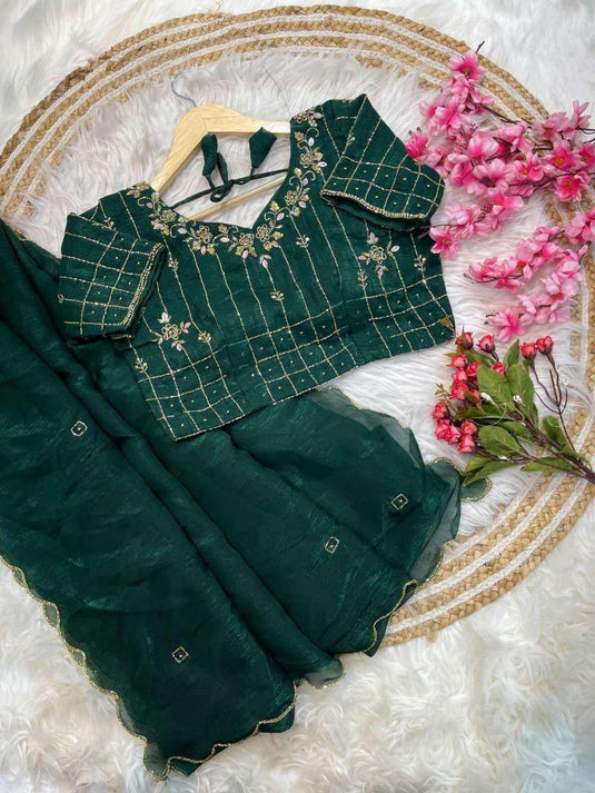Bottle Green Organza/Silk Saree with Scalloped Border and Embroidered stitched Blouse in Germany
