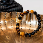 Buddha Armband aus Tigerauge & Obsidian mit vergoldetem Buddha-Kopf
